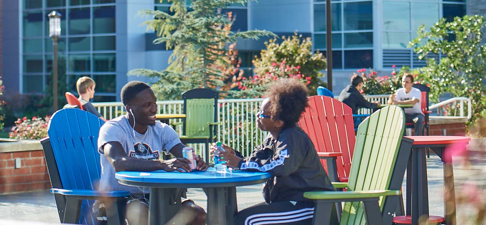 students sitting outside