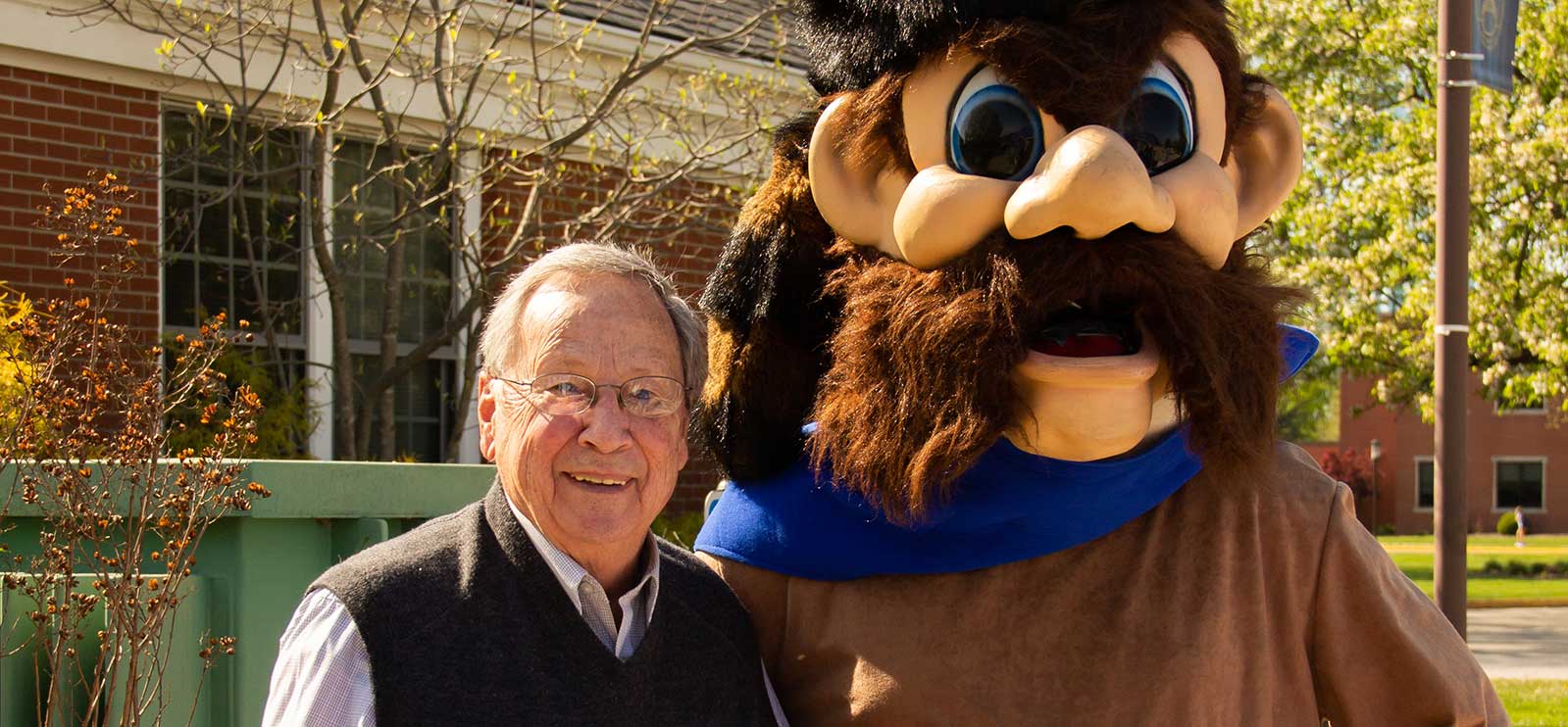 faculty with a mascot